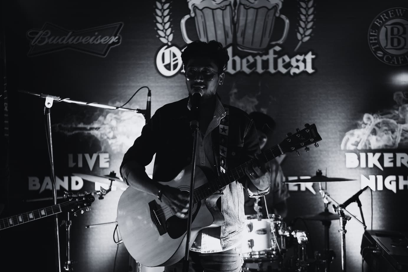 Harsh Shetty performing solo with an acoustic guitar